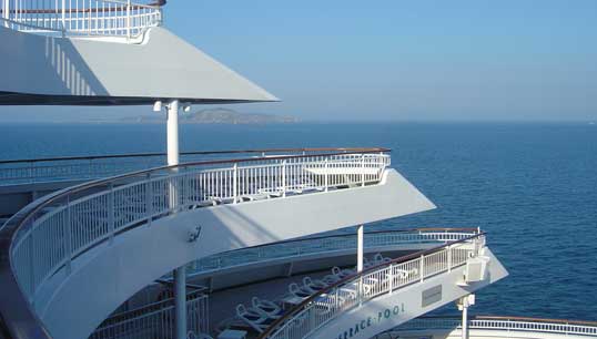Image:Crew members required to work on Carnival UK vessels in lay-up describe a rather quiet, lonely existence maintaining the cruise ships at berth, but they say the company has been watching over its employees' mental health. Image: P&O Aurora stern, Wikimedia Commons.