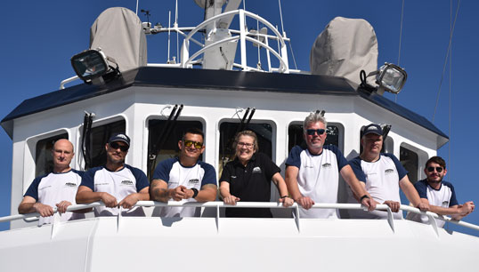 Image:The MV Astra crew shortly before departing Lanzarote for the Southern Capes circumnavigation. L-R: Luke Crossley (chief engineer), Orlando Perez Lopez (staff captain), Carlos Casola (junior watch officer), Kat Heathcote (designated person ashore), Iain Macneil (captain), Paul Griffiths (chief engineer), Michael Napier (chief mate). 