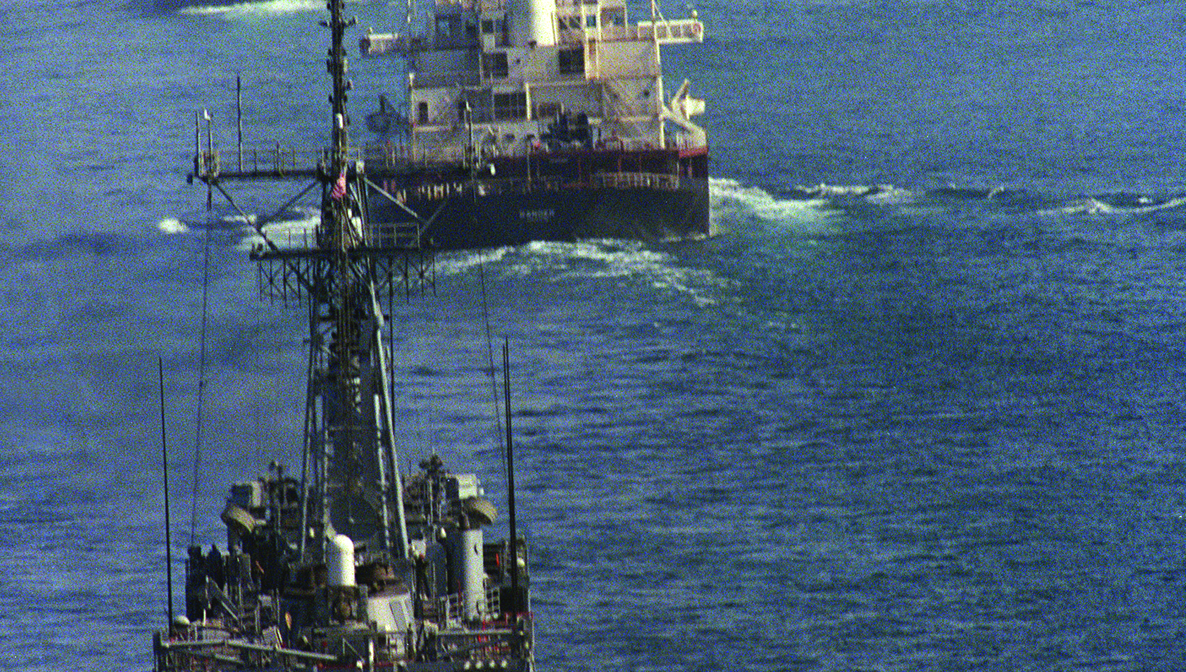 Image:Convoy of reflagged tankers off Dubai escorted by a US warship ship during the 1980's 'tanker war' Gulf conflict: Image: Getty Images