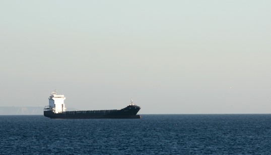 Image:An empty container ship off the coast of Portugal. Image: Wikimedia Commons/Kaktuslampa
