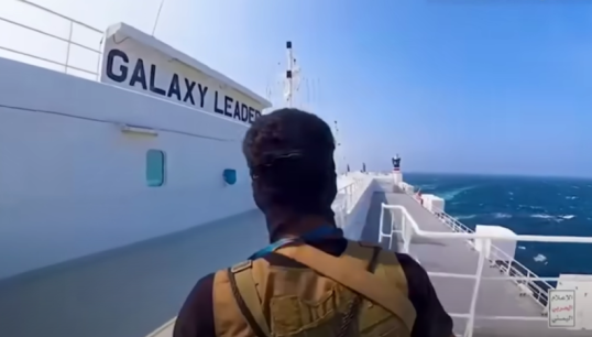 Image:A fighter from Yemen's Houthi movement onboard the vessel during the hijacking operation. Image: Houthi press release