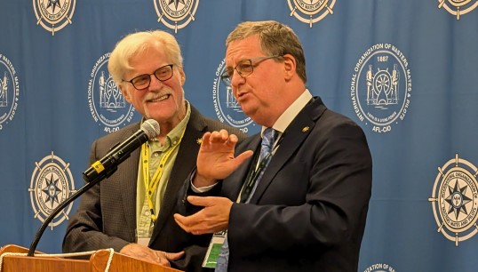 Image:Nautilus general secretary Mark Dickinson (right) speaking at the 90th Convention of the International Organization of Masters, Mates & Pilots (IOMMP), with IOMMP president Don Marcus. Image: Nautilus International