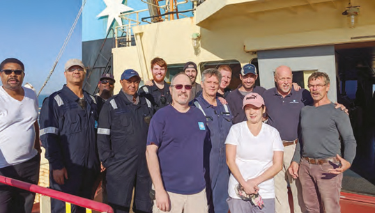Image:Maersk Montana crew with the rescued sailor. (Front row, left to right) Third mate Steven
Miller; Claribel Cabral, SA; (second row) James Cameron, chief steward; Sunnil Motley, bosun;
Fethanegest Demoz, AB; Eddie Almodovar, electrician; chief mate Forrest Halley; Captain
Richard Hoey; Miki Chumachenkov (survivor); (third row) George Phillips, AB; Blaine
McDonough, cadet; Brett Starr, cadet; chief engineer Jeremy Travers. Image: Maersk Montana crew