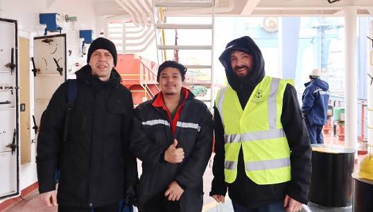 Image:Odessa port chaplain Alexander Smerechynskyy (right), and assistant chaplain Rostyslav Inzhestoikov visit a seafarer in  the port of Odessa. Image: Stella Maris