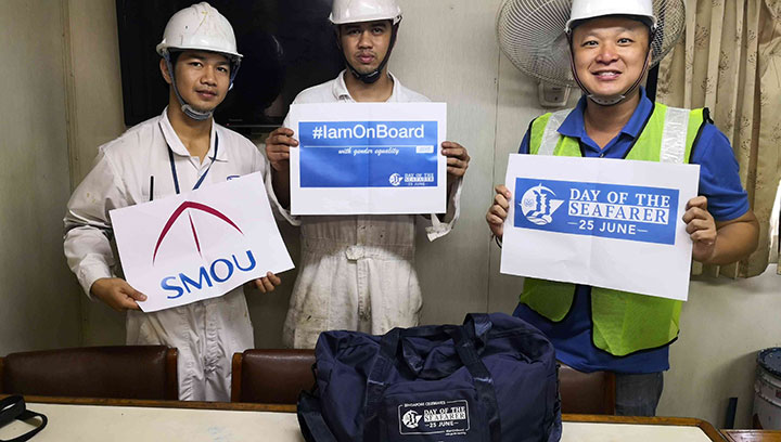 Image:Seafarers on the containership Mathu Bhum in Singapore receive their gift hampers