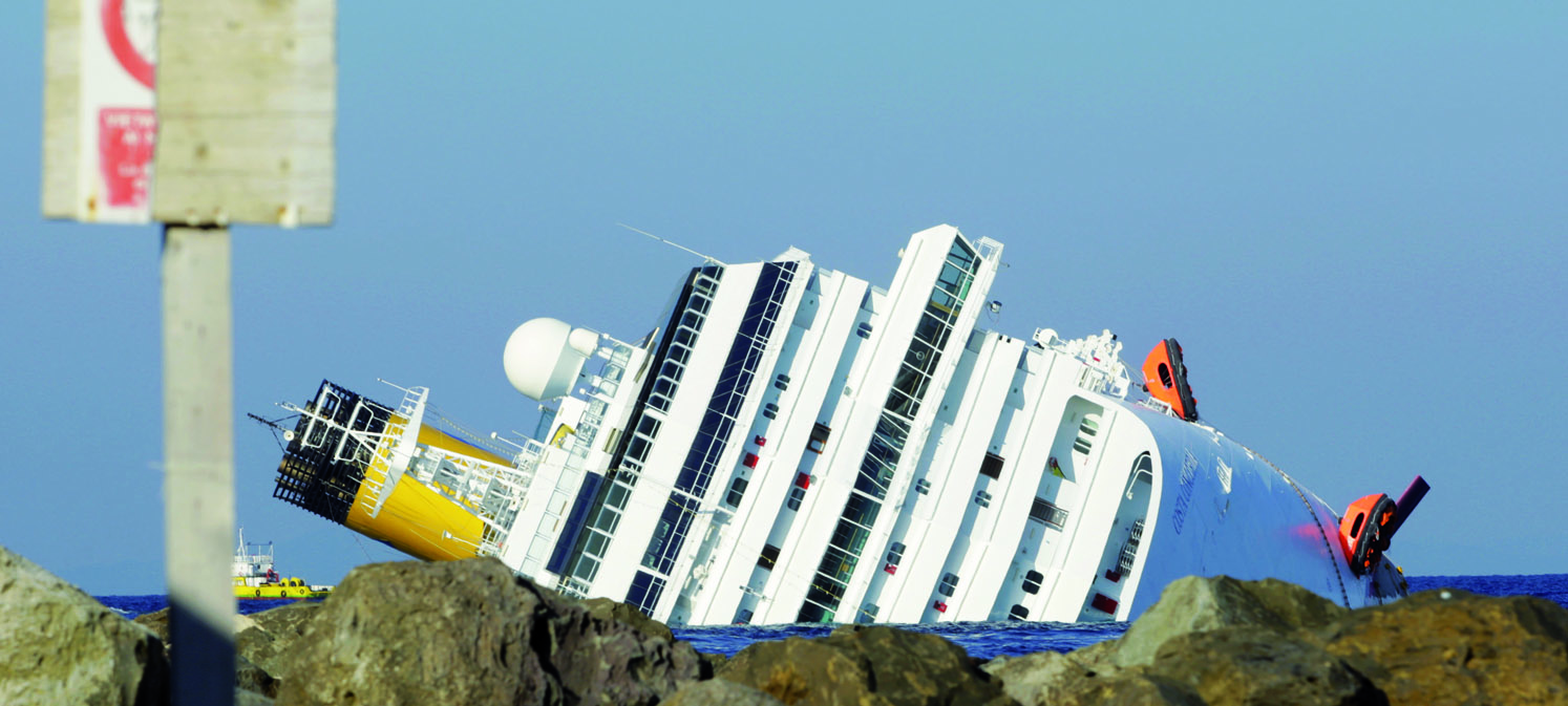 Image:The capsized Costa Concordia before salvage operations began.