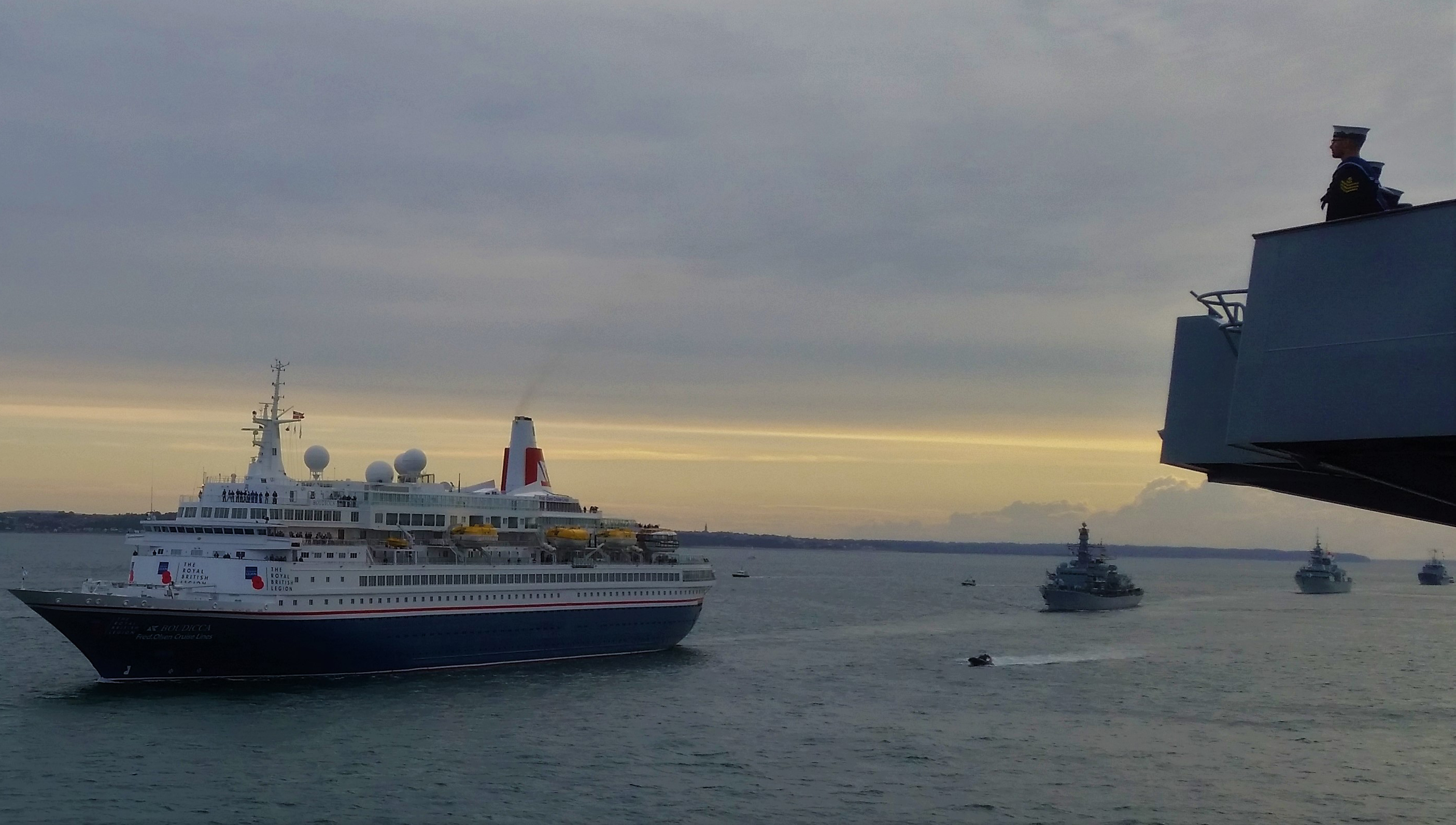 Image:The RFA replenishment vessel Fort Victoria led a sail-past of naval ships to honour the D-Day veterans onboard the Fred Olsen passengership Boudicca.