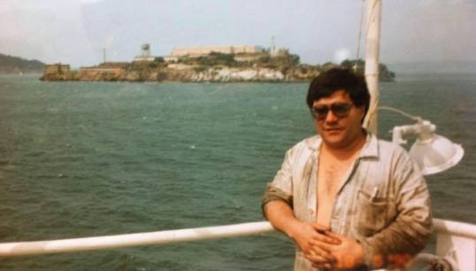 Image:Retired chief engineer Roy Ferguson onboard the Wellington Star about April 1990, going into San Francisco with Alcatraz in the background. He was once also a voluntary liaison officer for Nautilus in Belfast. Image: supplied with permission