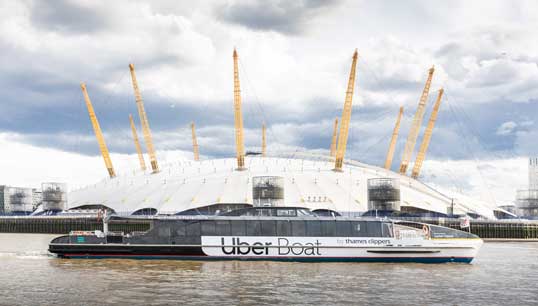 Image:The new Uber Boat by Thames Clippers passes the O2 Arena in its debut on the River Thames. The new joint brand has been created for the naming rights and ticketing partnership. Image: Thames Clippers