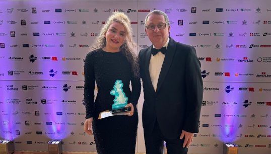 Image:2024 Bevis Minter Award winner Scarlett Barnett-Smith accepting her award from Nautilus general secretary Mark Dickinson at the Maritime UK award ceremony in Belfast. Image: Maritime UK