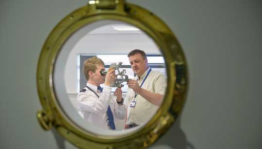 Image:A cadet being trained in traditional celestial navigational using a sextant. Image: Getty Images