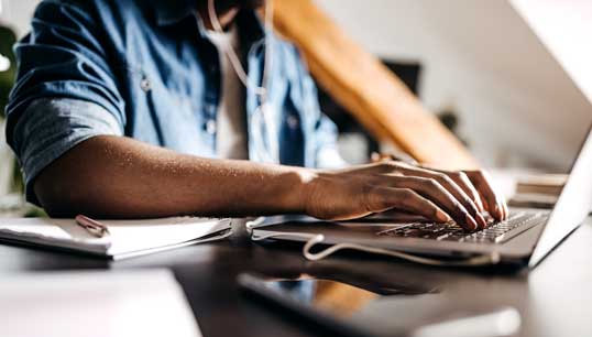entrepreneur-working-on-laptop-online-royalty-free-getty-images-1307759049-web.jpg