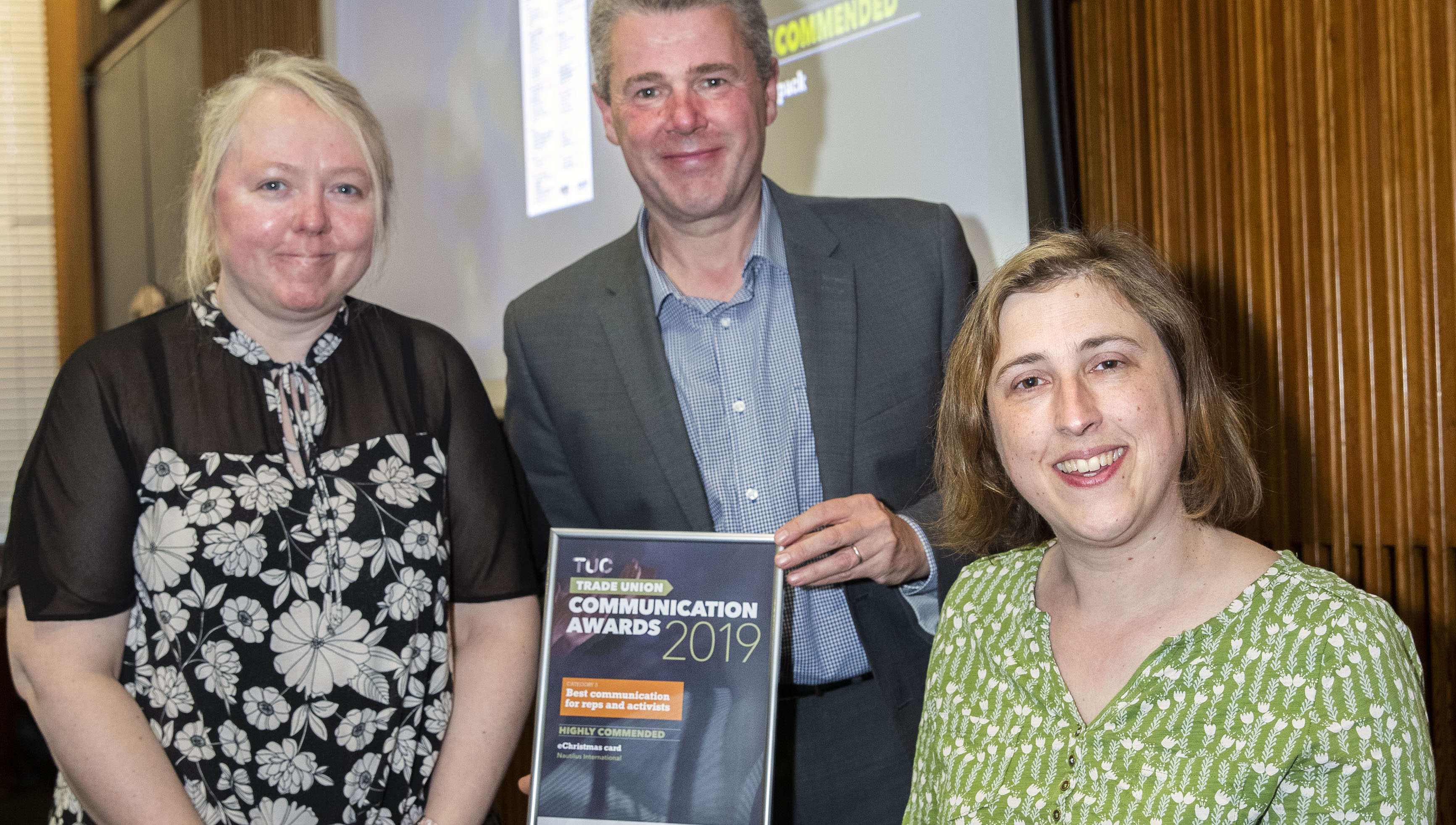 Image:Winning team: (L-R) Nautilus production editor June Cattini and chief sub editor Sarah Robinson pick up the award from TUC president Mark Serwotka. 