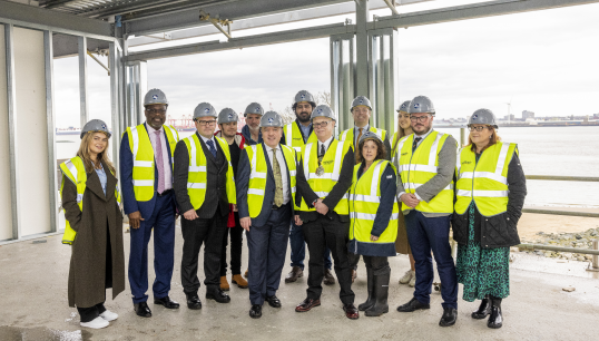 Image:Shadow UK minister Mike Kane MP (centre) with members of Wirral Council and Nautilus International staff on the site of new residents' apartments at Mariners' Park during the visit. Image: Brad Wakefield / Nautilus International