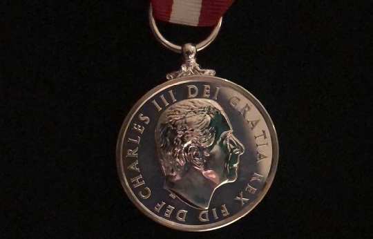 Image:The 2023 Merchant Navy Medal with the first ever likeness of His Majesty King Charles III adorning a medal of state.