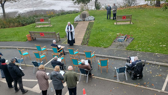 Image:The Nautilus Mariners' Park Armistice Day 2021 service, held near the Atlantic Stone outside the Trinity House Hub on the Mariners' Park Estate in Wallasey, UK.