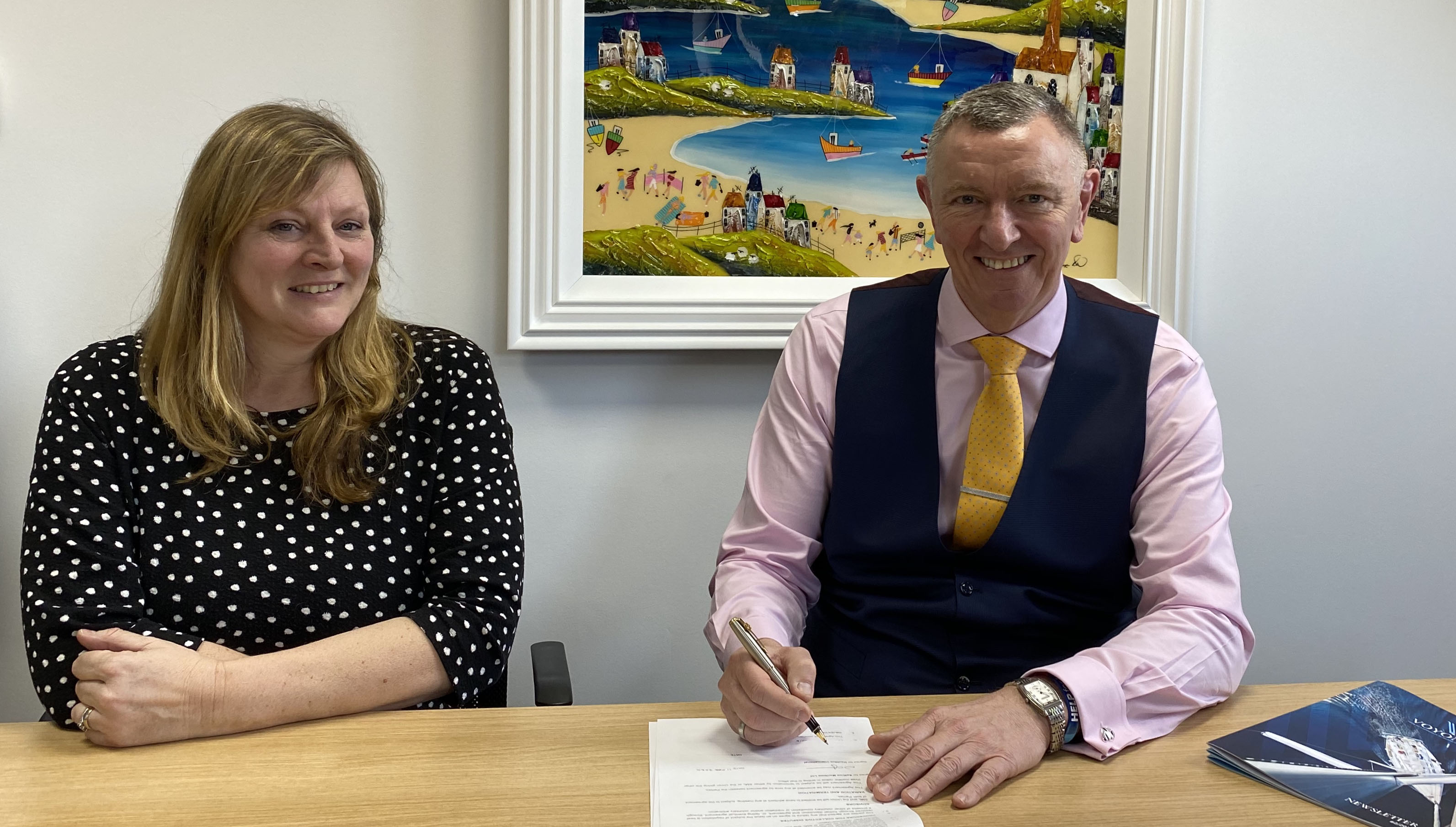 Image:Neil Carrington signing the CBA for Saffron Maritime Limited with Esme Davis Saffron senior HR 