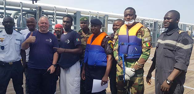 Image:Anthony Nicholas (left) and Oussman Sarr (right) after the rescue at Dakar port. Image: Anthony Nicholas