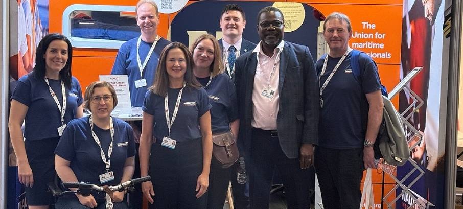 Image:Nautilus International officials at the Union's 'ship's cabin' exhibition, stand 61, at the Brighton TUC Congress 2025. It showcased the urgent need to strengthen workplace protections for maritime professionals. Attendees were invited to see what it’s like to live and work onboard a deep sea vessel. Visitors could experience a real-life safety drill – by donning our immersion suit with the aim of quickly getting out of our cabin. Video screens also showcased our Nautilus TV YouTube channel.