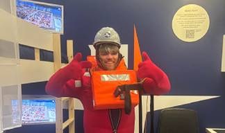 Image:John Whitcher of Fuel Poverty Action during a safety drill challenge in the Nautilus ship's cabin stand.