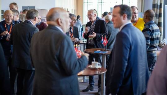 Image:Nautilus head of professional and technical David Appleton (right, foreground) chats with members during a coffee break at a Nautilus conference. Image: Brad Wakefield
