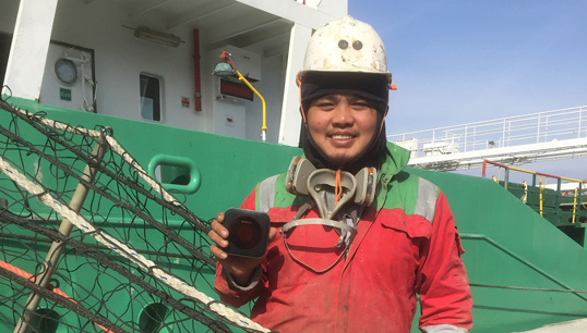 Image:A seafarer with one of the 40 MiFi project units which have been deployed to eight maritime welfare charities via  UK ports. Image: Stella Maris