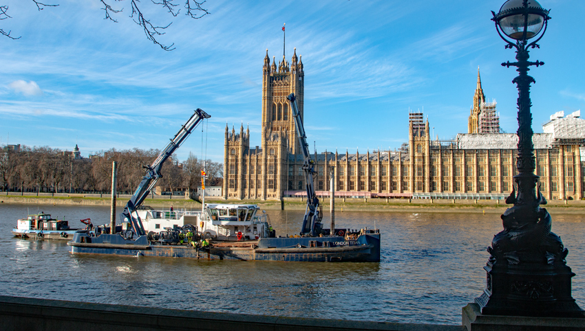Image:PLA mooring maintenance vessel, London Titan, working opposite the Houses of Parliament. The 14th Maritime HR conference will be held in London.

