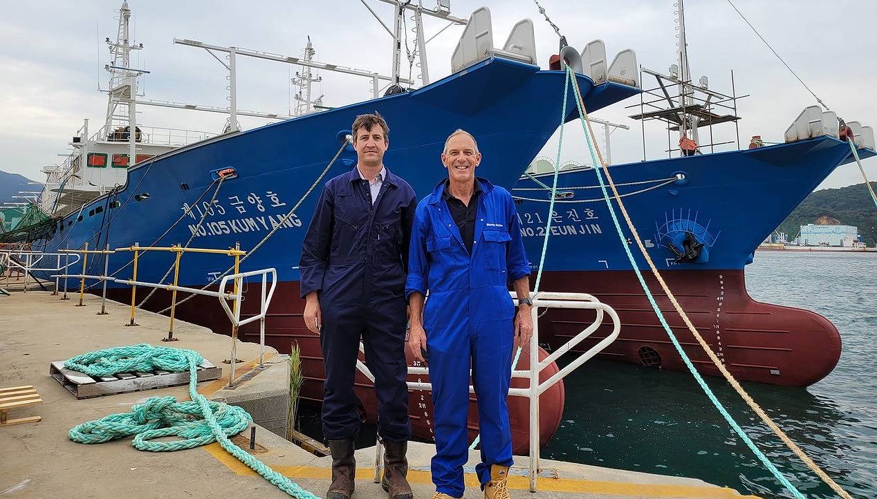 Image:Robert Greenwood (left), Nautilus member, fishing skipper and trustee of The Seafarers' charity, was among the 14 Merchant Navy Medal recipients for 2022.  Pictured with a colleague, Nigel Blazeby, while working in Busan South Korea. Image: Robert Greenwood.