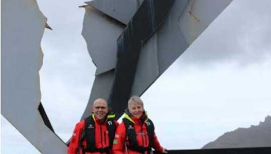 Image:Well travelled: Gaynor and her husband Iain during their travels at Cape Horn in front of the Albatross Memorial for mariners lost in the Drake Passage, where the Atlantic and Pacific Oceans meet.