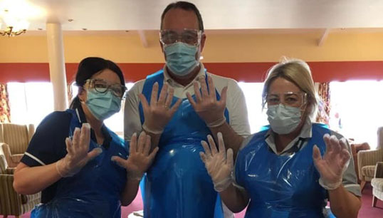 Image:Jane Davies, right, with welfare team members Emma Cooke RGN and Paul Gorman during Covid-19 swab testing.