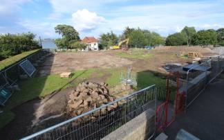 Image:Clearing the site of the grass and stripping the topsoil. The new complex will have views of the River Mersey. Mere Bank (distant building), bought by a Nautilus predecessor Union, the Mercantile Marine Service Association, has been cleared. Image: Time-lapse Manchester
