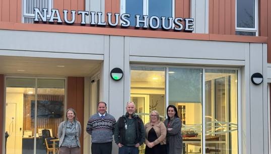 Image:Nautilus staff at the entrance to the new Nautilus House in December 2024 (L-R) : Alison Rowe, Nautilus House administrator; Andrew Jones, director of welfare and care; Liam Hayes, IT manager; Yvonne Parry, Nautilus International administrator; Laura Molineux, Nautilus International strategic organiser. Image: Nautilus International