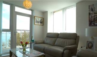 Image:A Nautilus House apartment living room with balcony views across the River Mersey. Image: Nautilus International