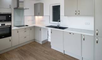 Image:Each apartment includes an emergency alarm system, an ensuite wet room, and accessible facilities in the kitchen (above). Image: Beccy Lane, Positive image Photography
