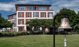 Image:The much-loved beautifully maintained bowling green (foreground) provides both  recreational and a chance for social connection.  Image: Beccy Lane, Positive Image Photography