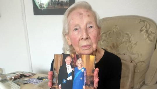 Image:Mrs Peggy Sharrock with the photographic card she received from King Charles and Queen Camilla wishing her 'warmest congratulations and heartfelt good wishes' on her 100th birthday. Images: Nautilus International