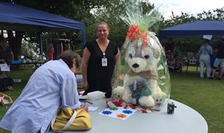Image:A name the teddy competition gets underway at the fair.